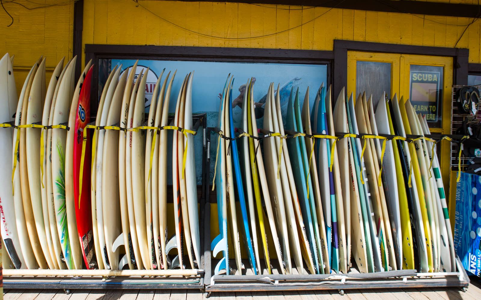 Rows of surfboards outside a colorful Haleʻiwa shop