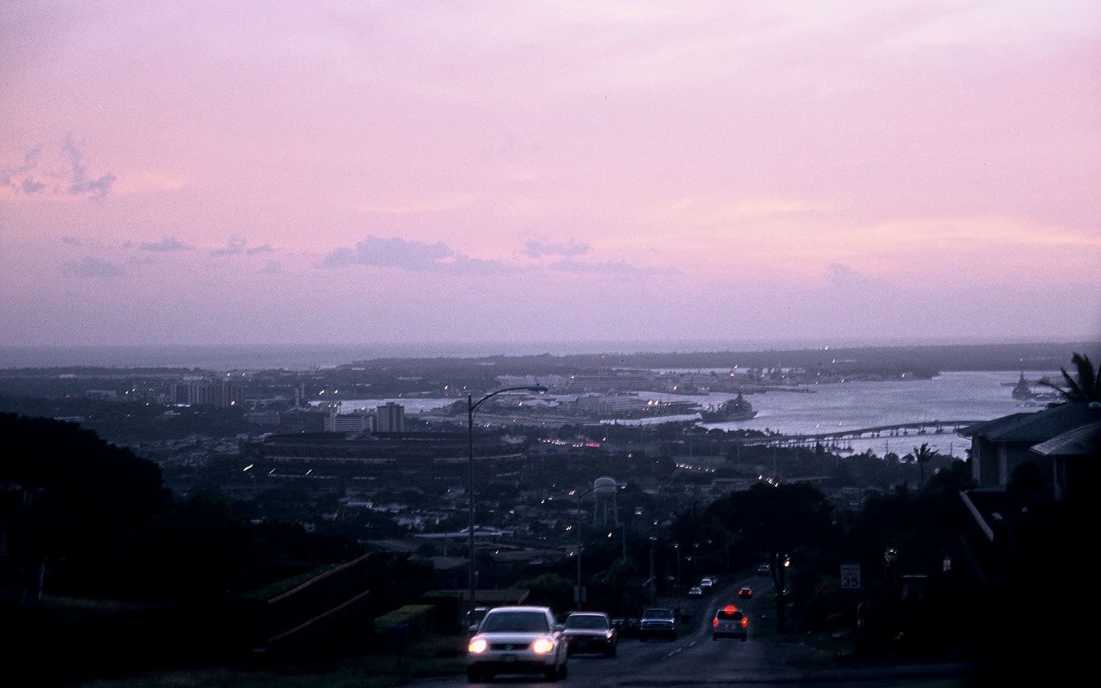 A view down an ʻAiea Heights street toward Pearl Harbor at dusk
